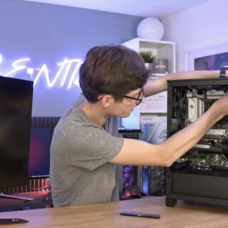 boy is fixing a computer