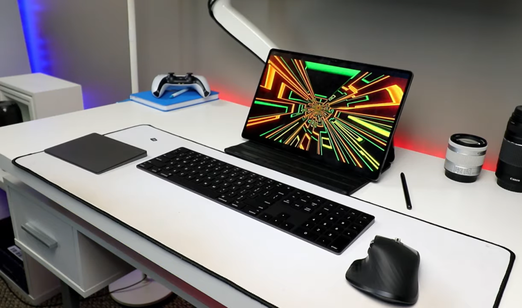 tablet, keyboard, PC mouse, joystick on white desk