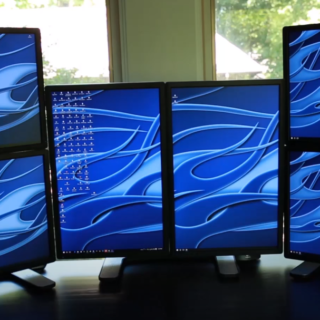 A computer arranged with six monitors.