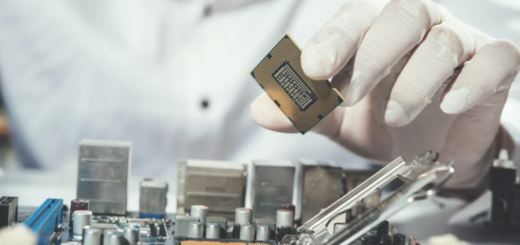 technician in gloves holding the computer hardware