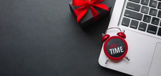 Clock on Laptop with a Gift Box Near